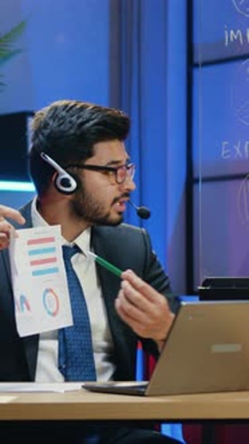 Professional Man Presenting Graphs During Online Meeting