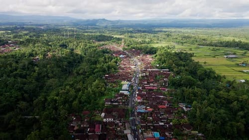 Traditional Bali Village Surrounded By Tropical Forest Tree Near Mountain Batur In Bali, Indonesia.