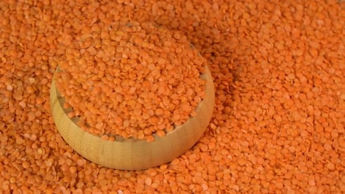 Orange Lentils in a Wooden Bowl, Close Up