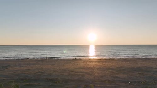 Aerial Video Stunning Ocean Texture Captured During Sunset with Golden Light Reflections on the