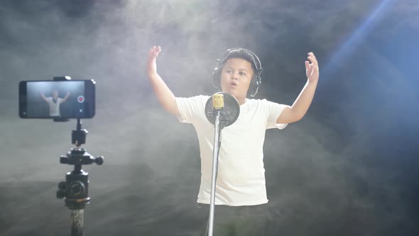 Young Asian Boy With Headphone Rapping While Recording Video By ...