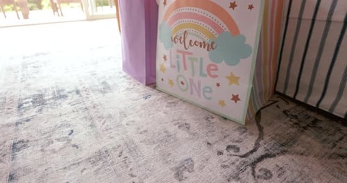 Baby Shower Gifts on Rug in a Home
