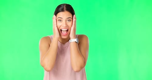 Shock, surprise and face of woman on green screen for good news, announcement