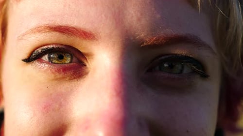 Green Eyes of Beautiful Girl Looking Into Camera Outdoor Face of Young Woman Illuminating By Bright
