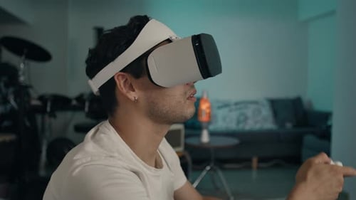 Man Experiencing Virtual Reality with Headset and Controller