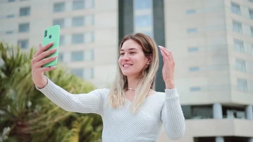 Young Woman Taking a Selfie in an Urban Setting