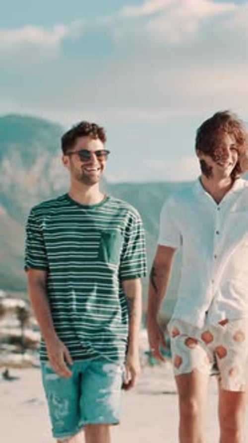 Men, friends outdoor or walking on beach with smile for bonding together