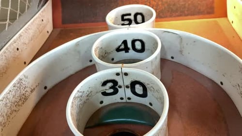 Close Up Of Two 40-Point Shots On An Antique Skee Ball Game