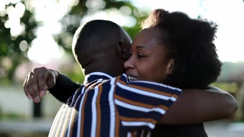 Loving Couple Embrace in Golden Sunlight Outdoors