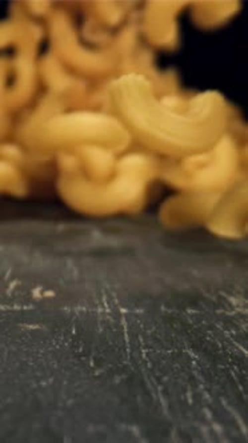 Dry Pasta Falls on the Table Filmed on a Highspeed Camera at 1000 Fps