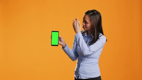 Female Model Presents Greenscreen on Phone Layout