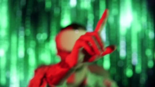 Man Using Virtual Reality Headset with Green Background