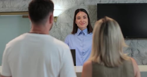 Administrator Giving Tourist Man Key Card at Hotel Desk Concierge Service Woman Smile in Lobby for