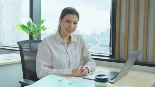 Portrait of Asian beautiful business woman smile while work in office.