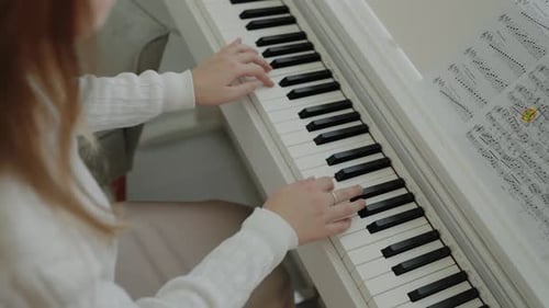 Home Music Studio Woman Music Education Hands Pressing the Piano Keys