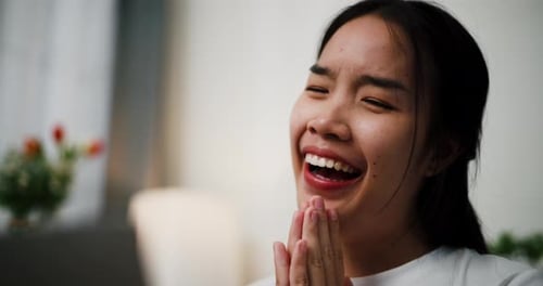 Happy Young Woman Reacts with Joy Indoors