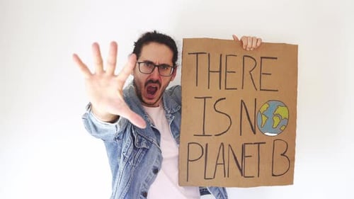 Man Protests About Climate Change Holding Sign