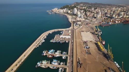 Port with fishing boats and vessels near Durres city in Albania, Mediterranean coastline
