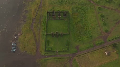 Aerial view of misty sunrise over Pura Ulun Danu Tamblingan Temple, Bali.