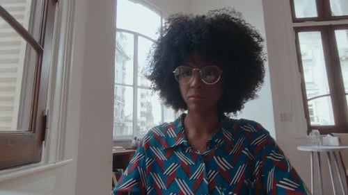 African-American Woman Web Calling on Laptop in the Office