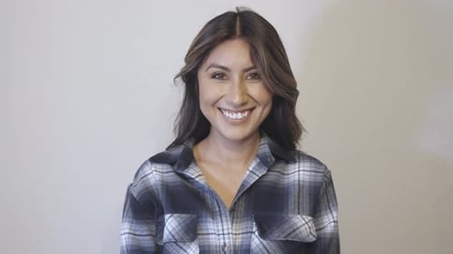 Woman Smiling and Throwing Hair Backwards