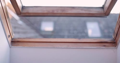 Rainy Skylight Above a Quiet Interior