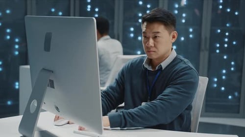 Young Handsome IT Technical Specialist Working in Data Center Digital Computer Office Server Racks