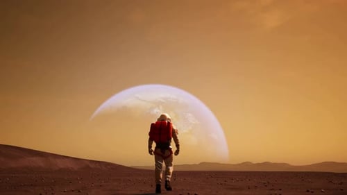 Astronaut Walks on Mars Surface Towards Distant Planet