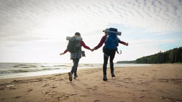 Backpackers Holding Hands Rear View Happy People Running on Sandy Shore ...
