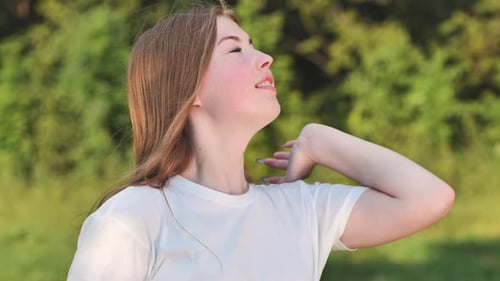 Portrait of a Young Schoolgirl in a Meadow