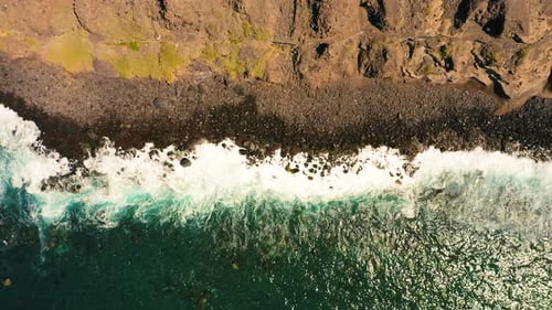 Ocean Waves Break on Stone Rocky Shore