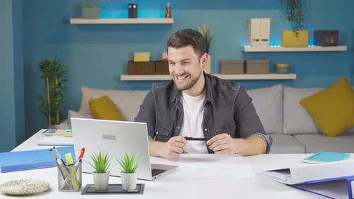 Man Working from Home on Video Conference Call