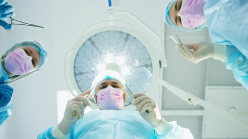 Medical Team Performing Surgery in Hospital Operating Room
