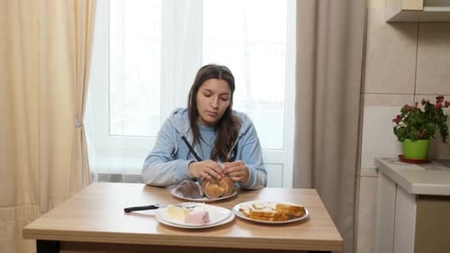 Young Woman Prepares Sweet Snacks at Kitchen Table