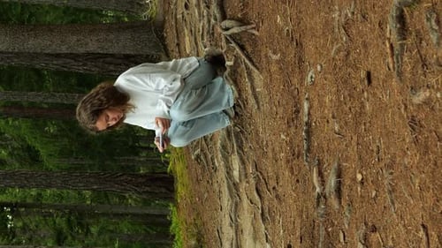 Two Teenage Schoolgirls Complete Assignments on Phones Amidst Forest Backdrop