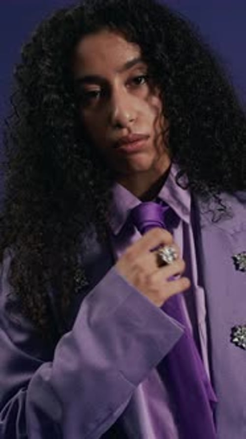 Stylish Young Adult Posing in Lavender Suit