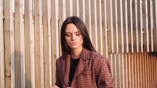 Young attractive Latina model girl walking around the city. The pier in the background.