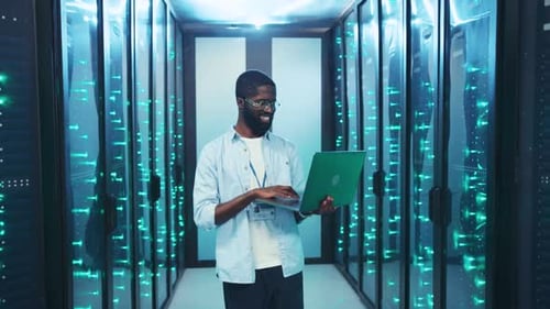 An IT Professional Manages Complex Server Systems in a Modern Room