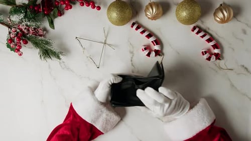 Santa Searching for Money Inside Empty Wallet