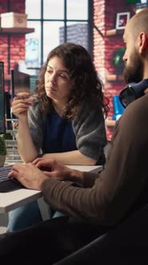 Vertical Video Man and Woman Creative Team Using AI to Generate Image Models
