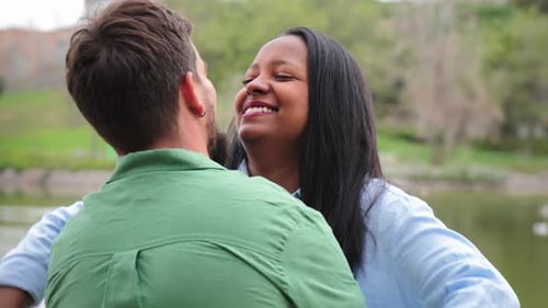 Couple Embrace in a Green Urban Park