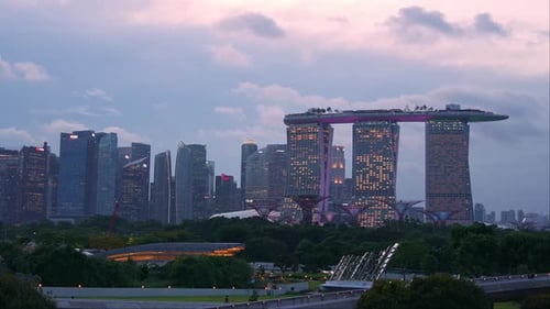 Day to night time-lapse shot at marina barrage rooftop park overlooking at Supertree grove in Garden