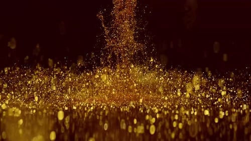 Golden luminescence captivating image of glittering gold particles cascading downwards against a dar