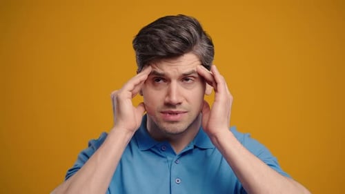 Mature Sick Man With HeadacheStudio Portrait Male Model Puts Hand On Head