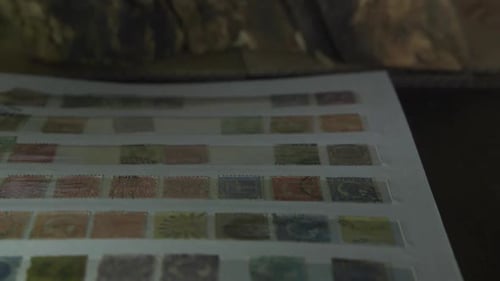 Closing an antique stamp album book in a grungy room.