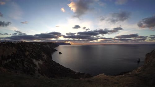 Sea Landscape with Rocky Coastline on Sunset Time with Cloudy Sky