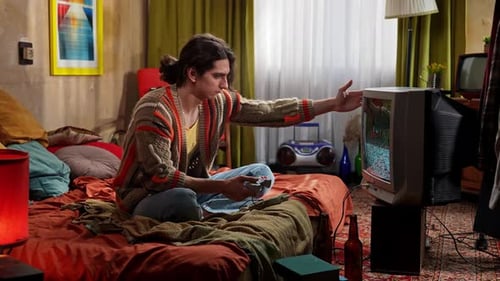 Man Plays Video Game on Retro Television