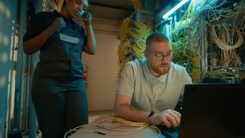 IT Techs Working in Server Room