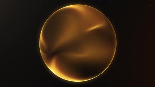 Golden yellow shimmering energy sphere of glowing liquid particles and magic plasma