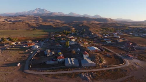 Aerial view of rural village and mountains at sunset, Turkey.